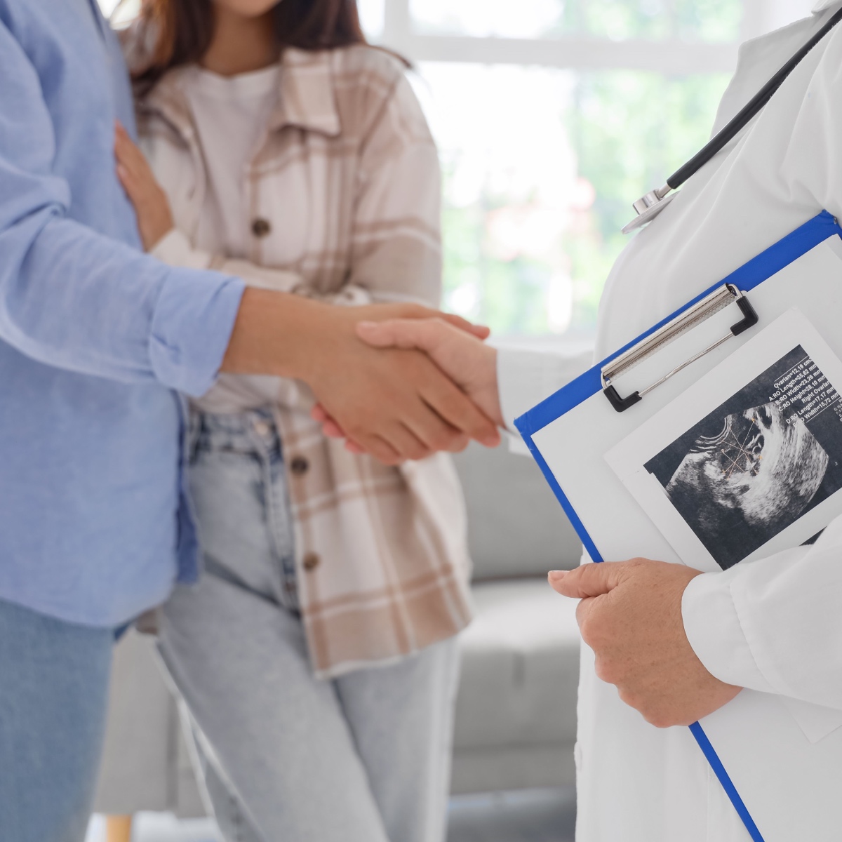 A couple talking to a Kingwood IVF specialist